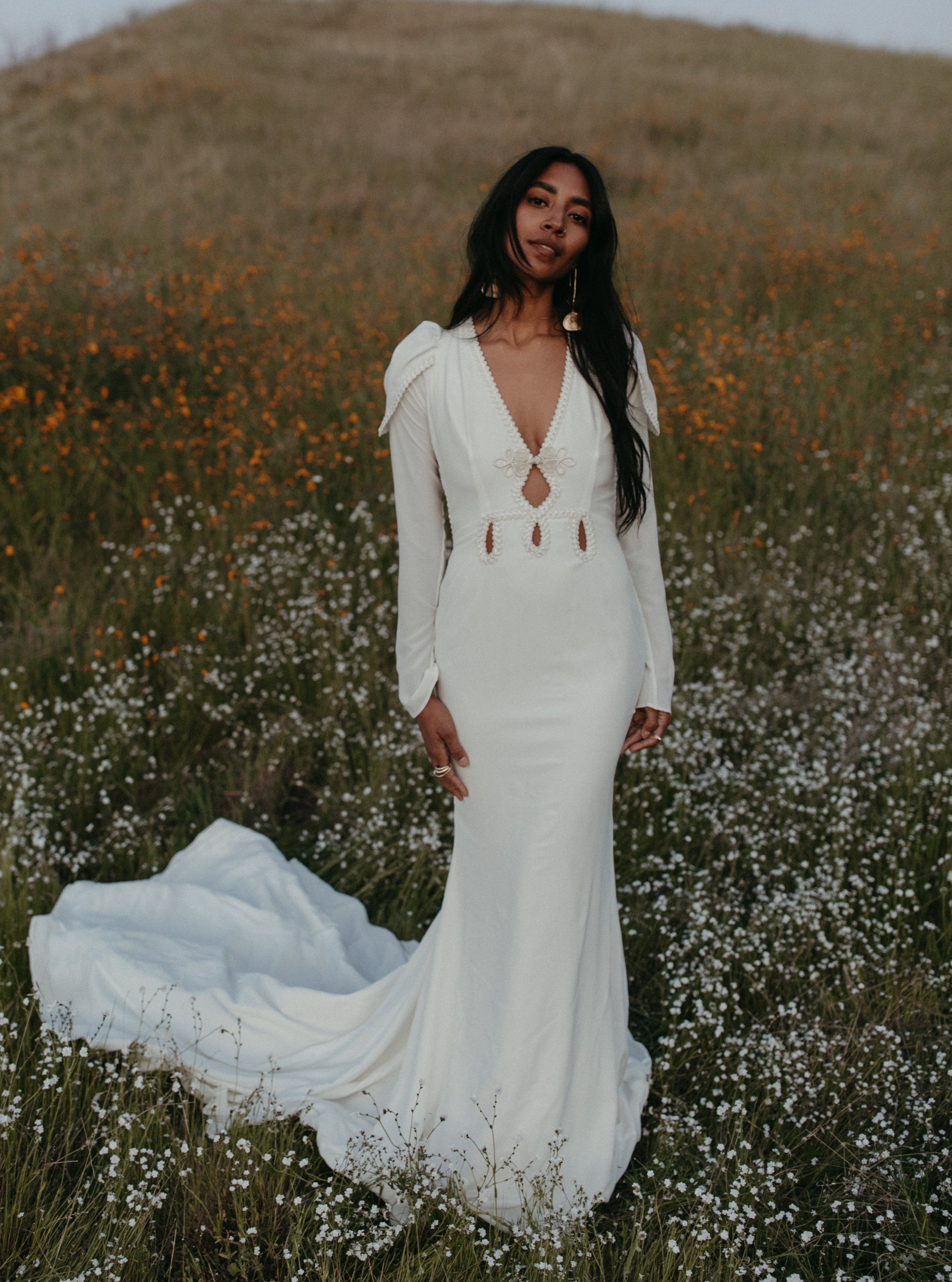 Silk ivory long sleeve backless wedding dress.